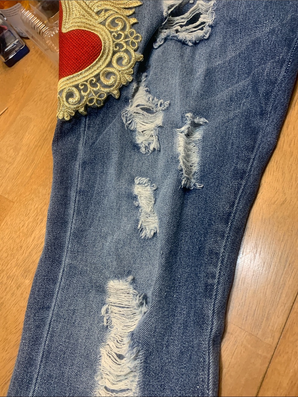 True Religion Blue Distressed Jeans with Red & Gold Heart Appliqués. Tote 4 - Picture 5 of 11